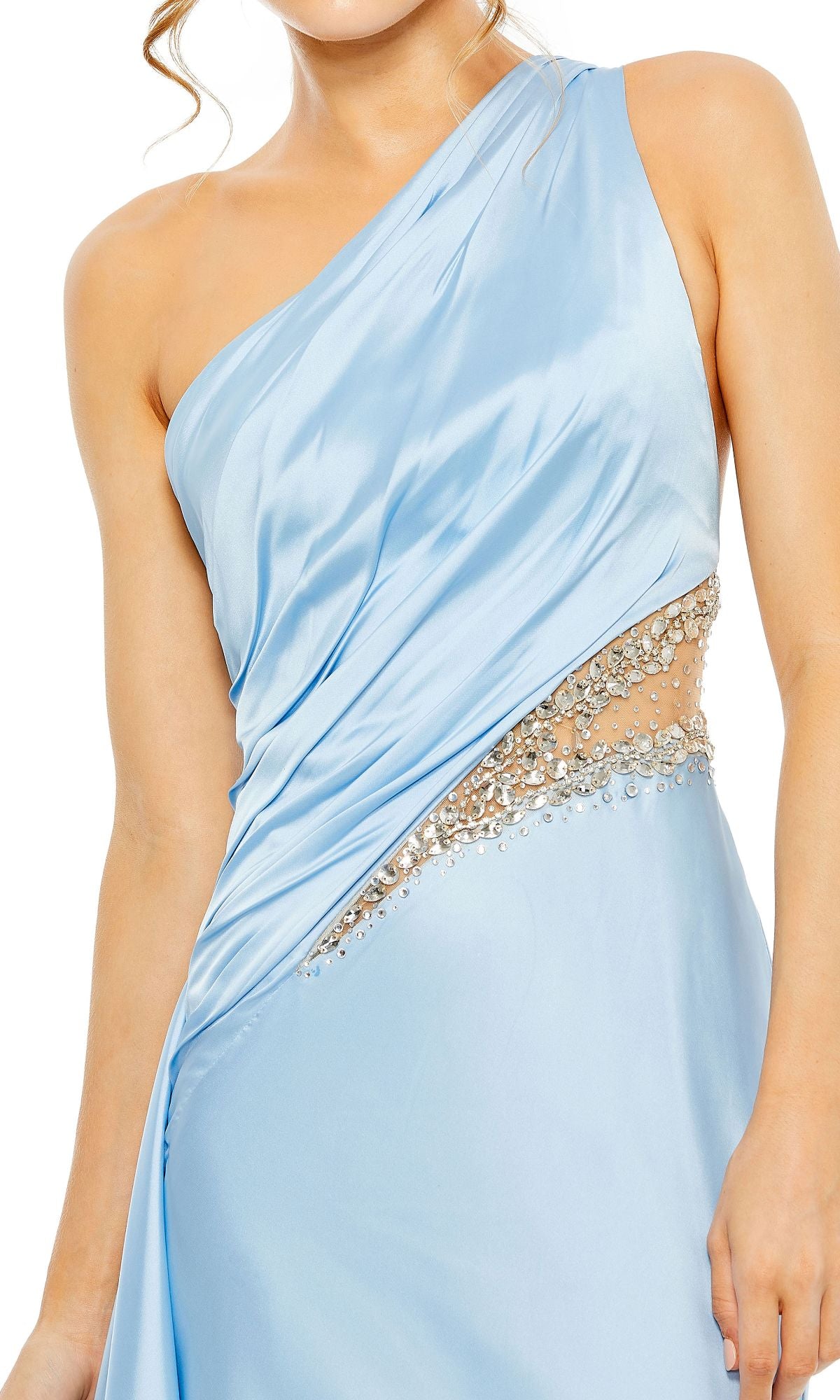 A person wearing the Mac Duggal 2210 Cut-Out One-Shoulder Formal Dress in light blue, featuring crystal embellishments and a sheer waist cutout.